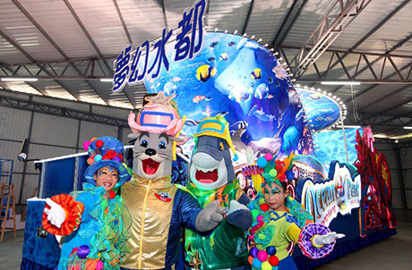 Photo 2 & 3: Ocean Park mascots Whiskers and James and fellow performers pose in front of the Float